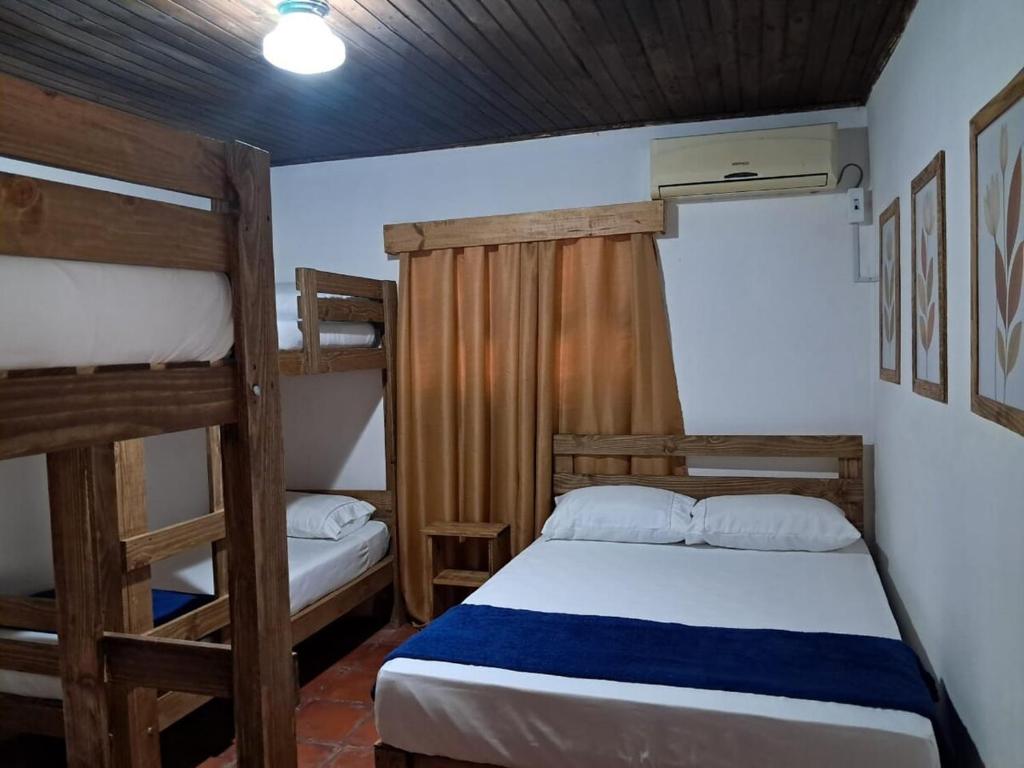 a bedroom with two bunk beds in a room at Casa Aconchego in São Gabriel