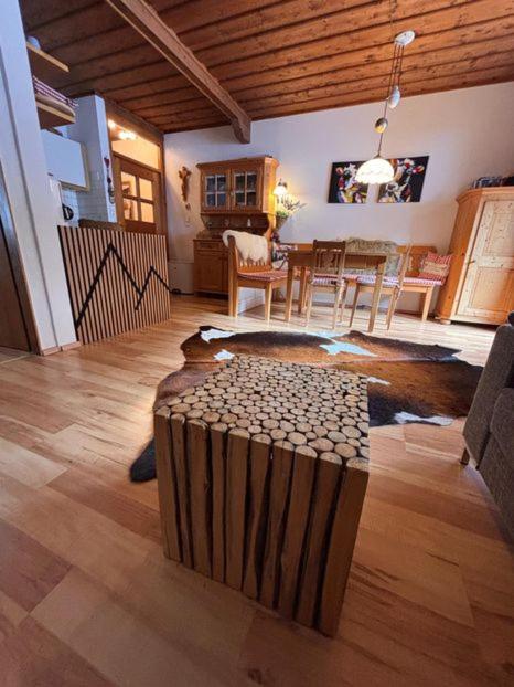 a living room with a table and a dining room at Appartement Hardenack in Innerkrems