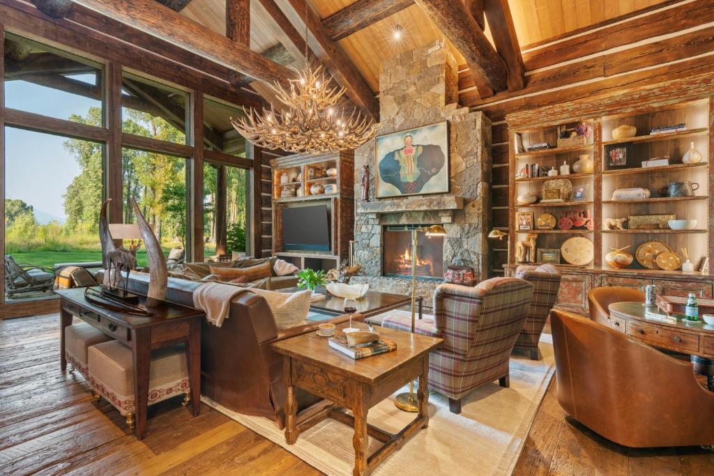 a living room filled with furniture and a fireplace at Abode at Teton Game in Wilson