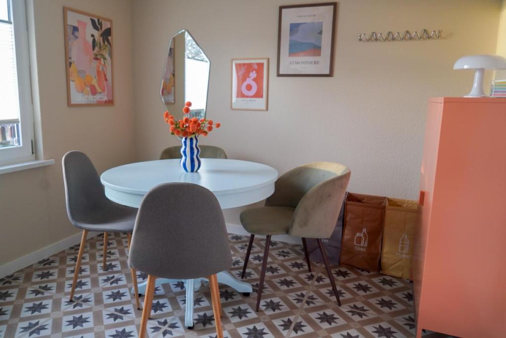 a dining room with a table and chairs at Bungalow Friedrich in Thale