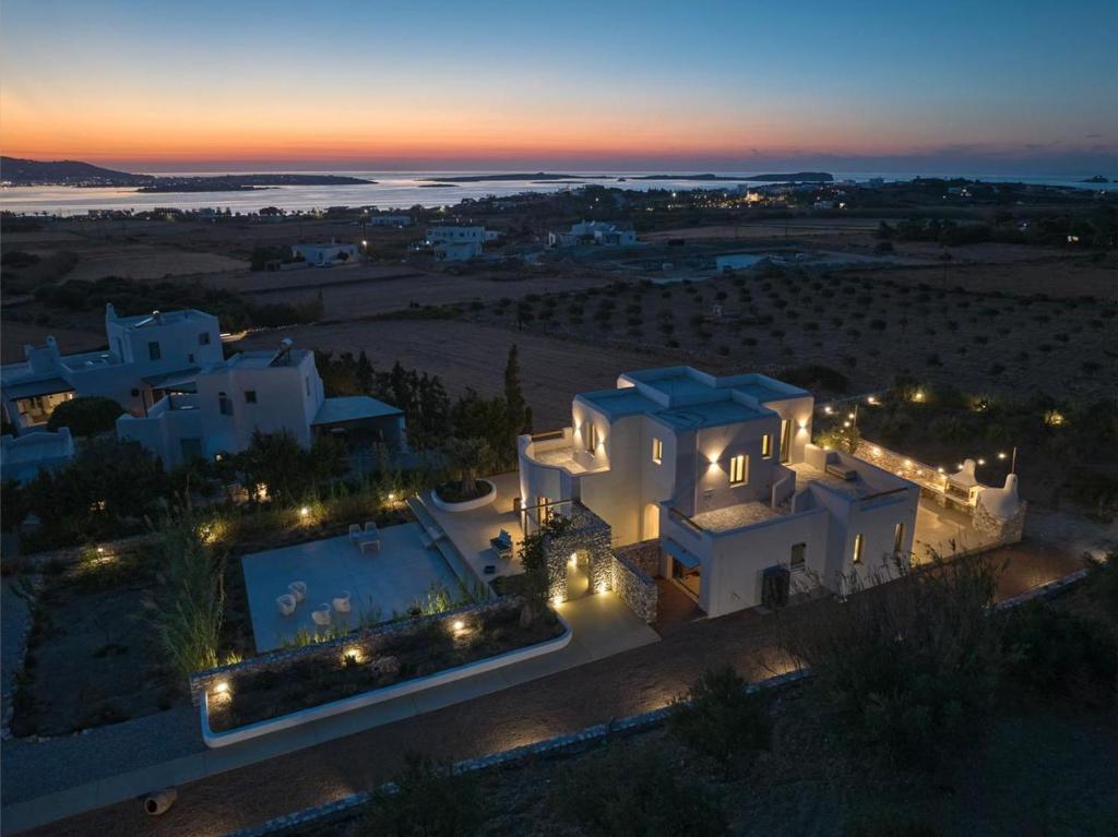 an aerial view of a villa at night at OceanLight Horizon - luxury Villa with private pool in Nea Cryssi Akti