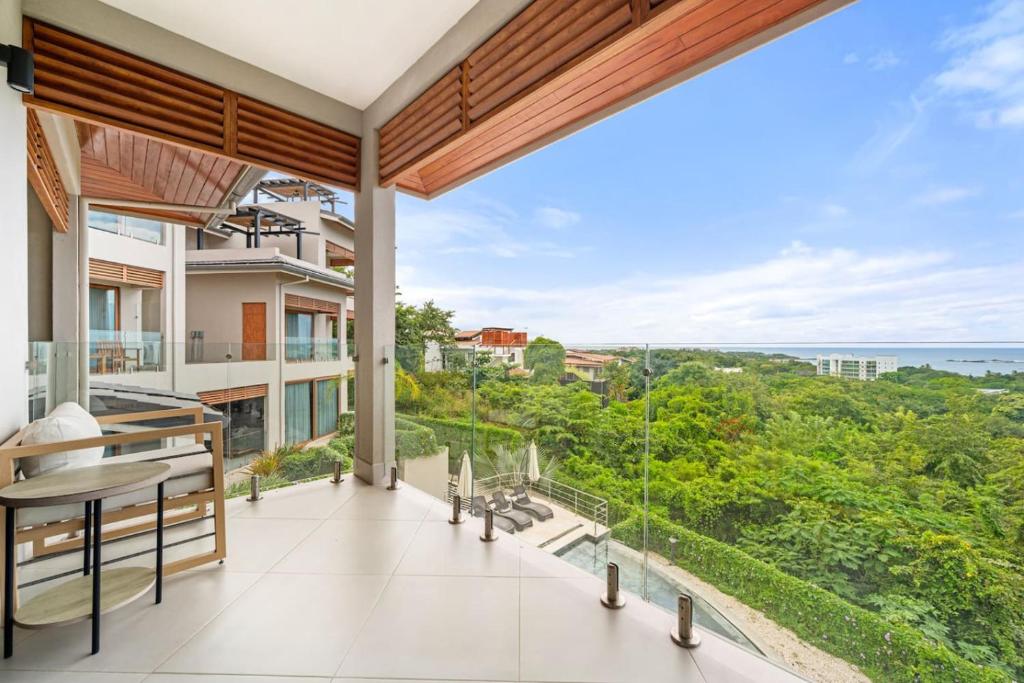 a balcony with a view of the ocean at Panaromic Oceanview Luxury 3BR Private Rooftop in Tamarindo