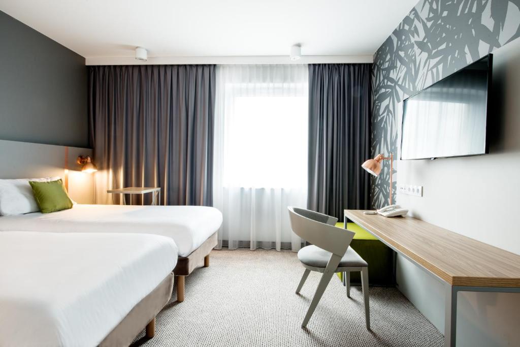 Posteľ alebo postele v izbe v ubytovaní ibis Styles Siedlce