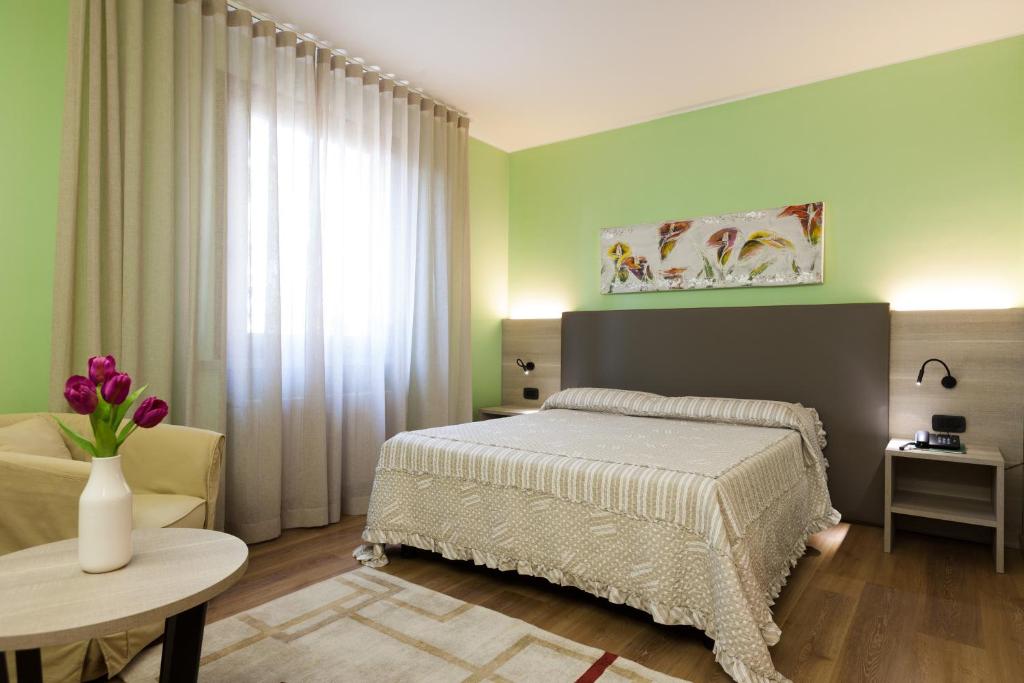 Postel nebo postele na pokoji v ubytování Hotel Prata Verde