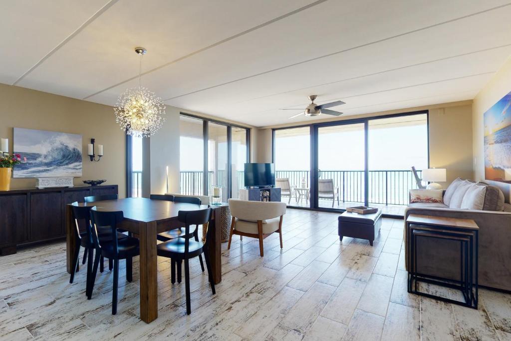 a dining room and living room with a table and chairs at Updated 3BR w/ Gulf Views: Suntide III - Unit 801 in South Padre Island