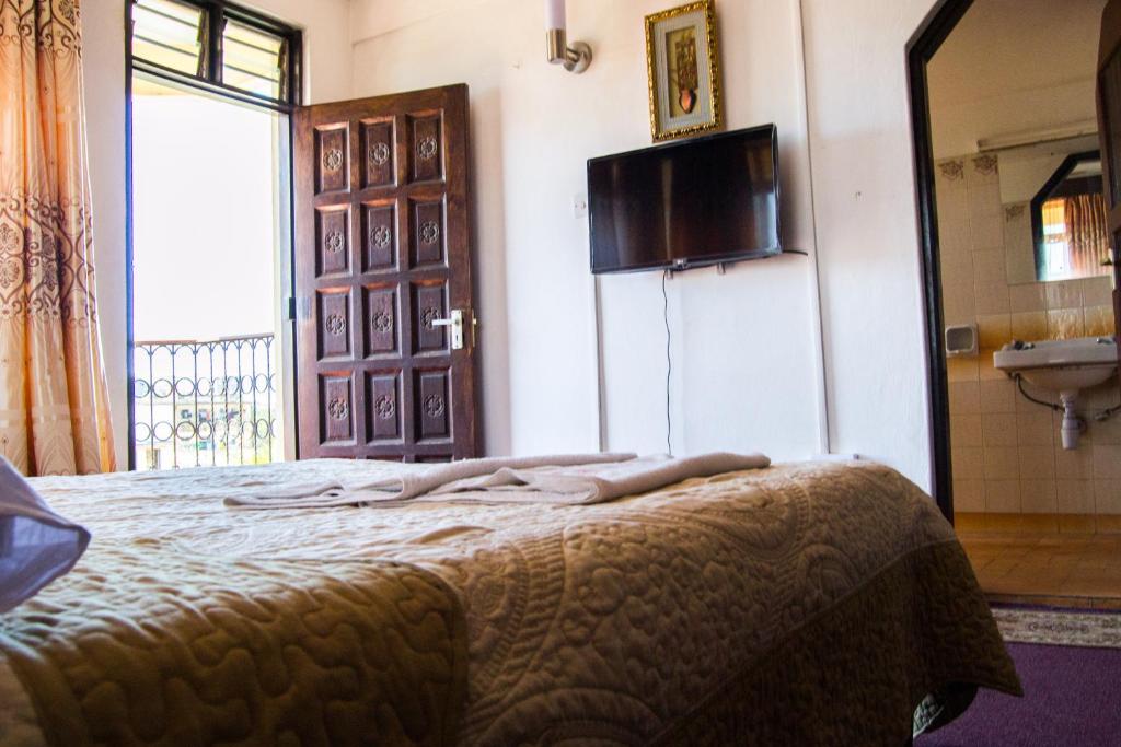 Postel nebo postele na pokoji v ubytování Manson Hotel