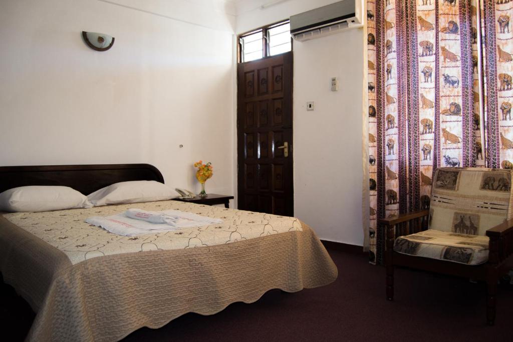 Postel nebo postele na pokoji v ubytování Manson Hotel