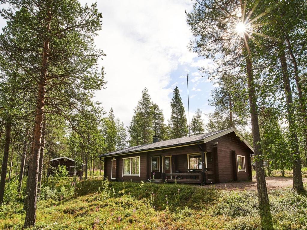 a small cabin in the woods with trees at Holiday Home Jormakka by Interhome in Levi