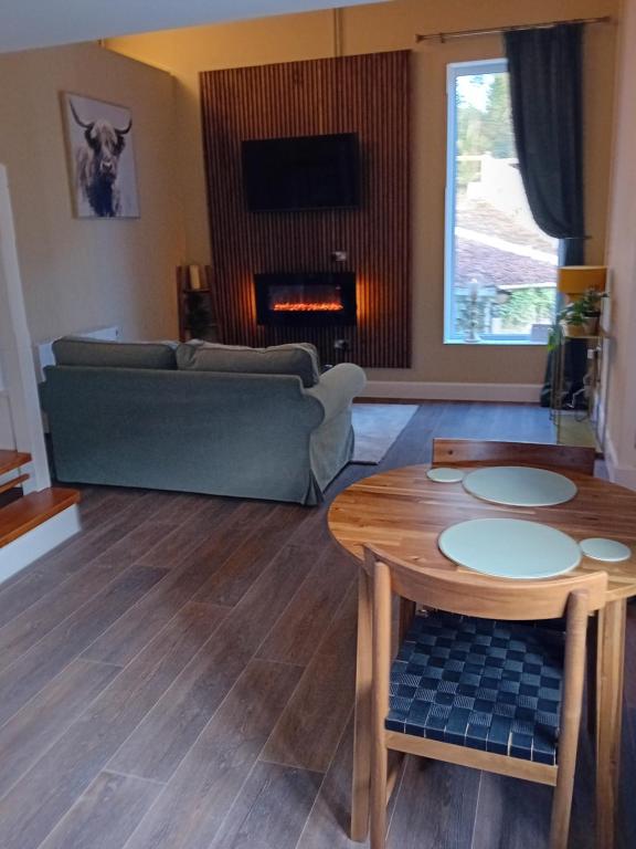 a living room with a couch and a table at River View at Silver River in Cadamstown