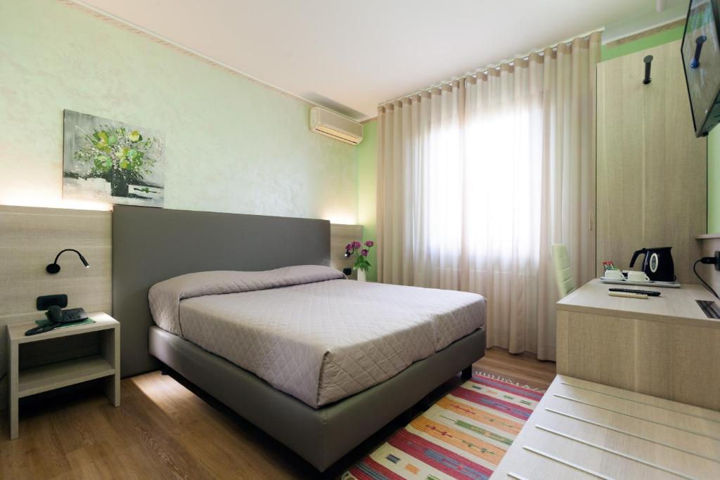 Postel nebo postele na pokoji v ubytování Hotel Prata Verde