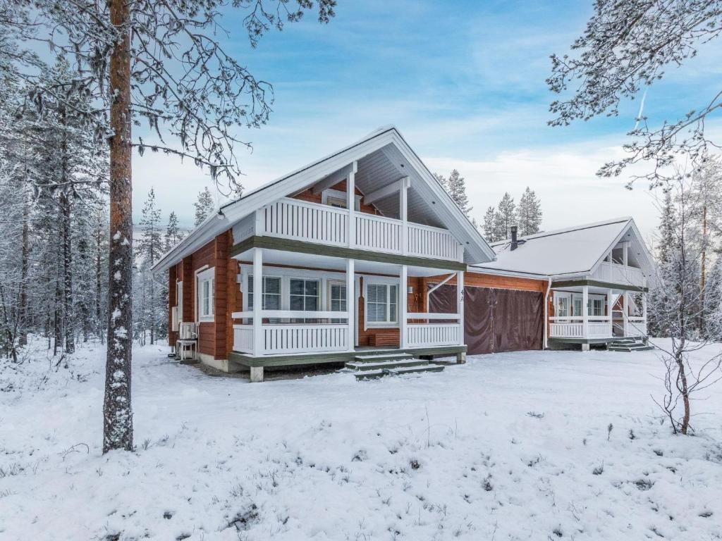 a home in the winter with snow on the ground at Holiday Home Arha by Interhome in Äkäslompolo