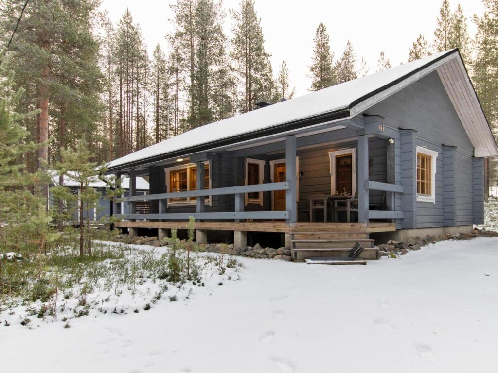 a cabin in the snow in the woods at Holiday Home Kuusenkolo by Interhome in Pyhätunturi
