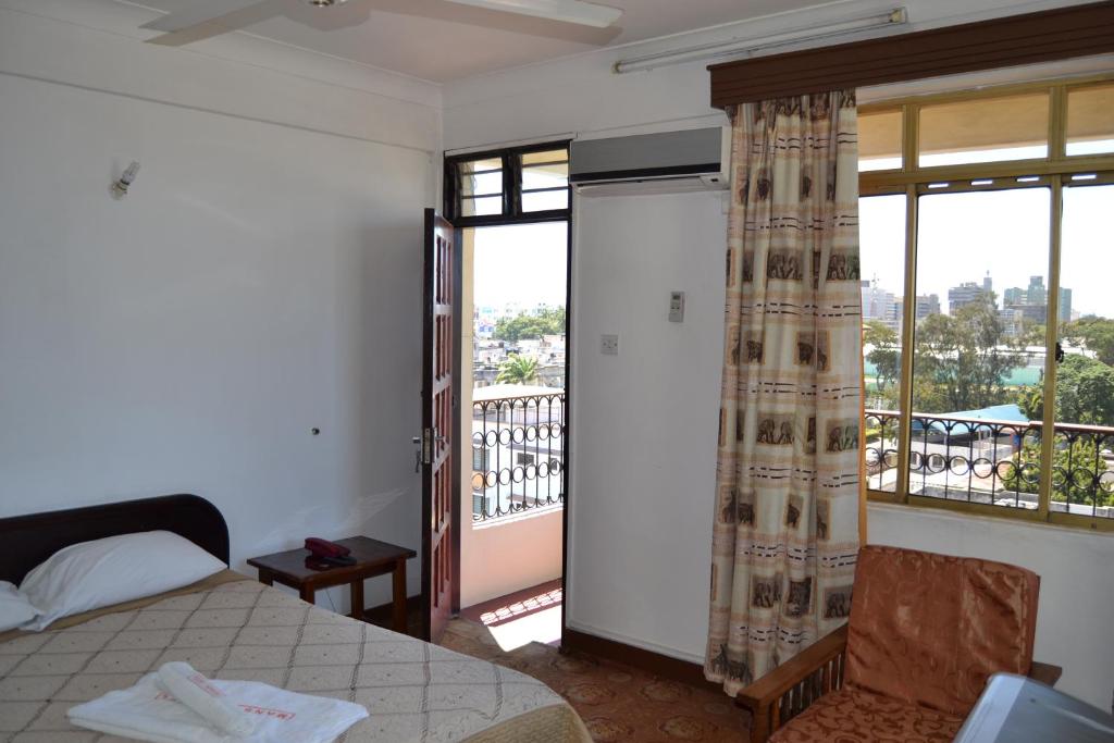 Postel nebo postele na pokoji v ubytování Manson Hotel