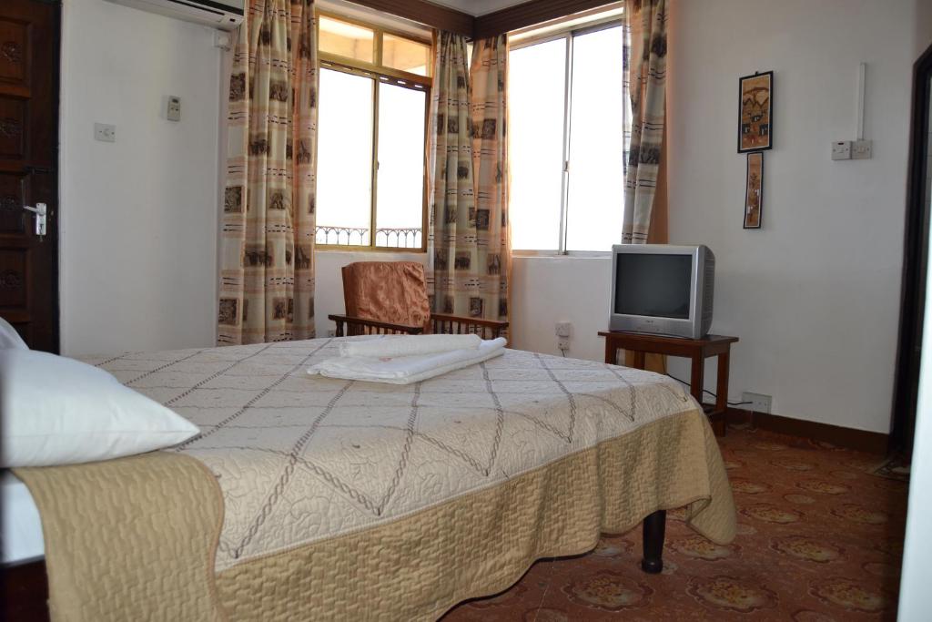 Postel nebo postele na pokoji v ubytování Manson Hotel