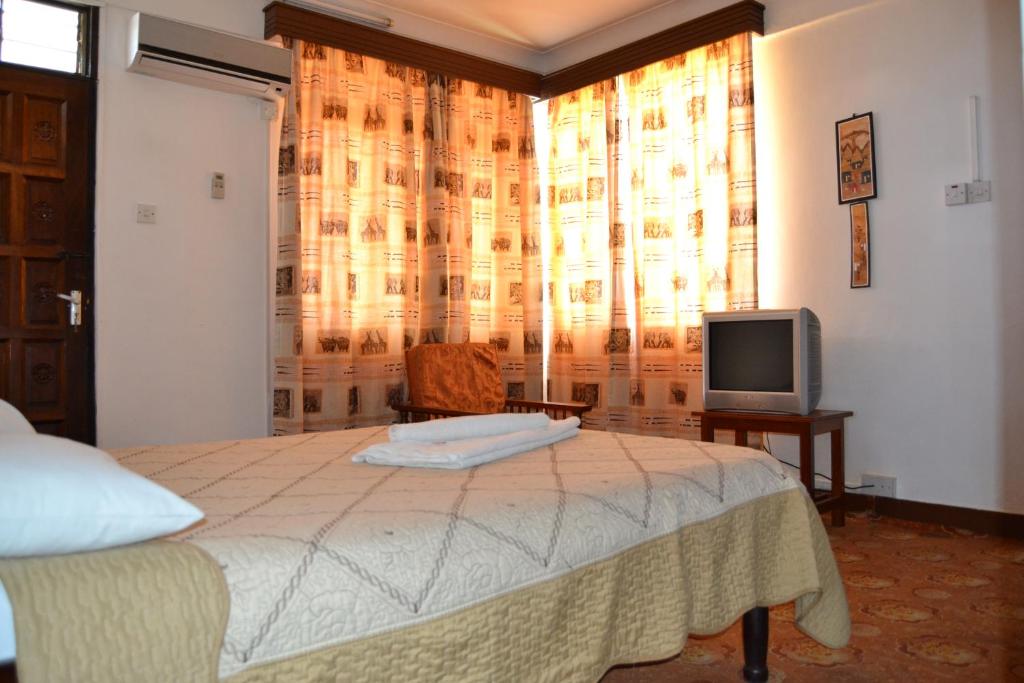 TV a/nebo společenská místnost v ubytování Manson Hotel