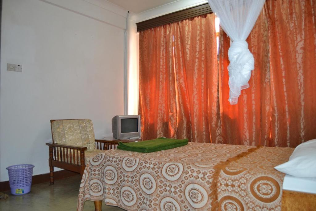 Postel nebo postele na pokoji v ubytování Manson Hotel