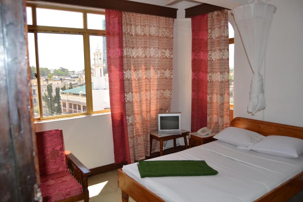 TV a/nebo společenská místnost v ubytování Manson Hotel