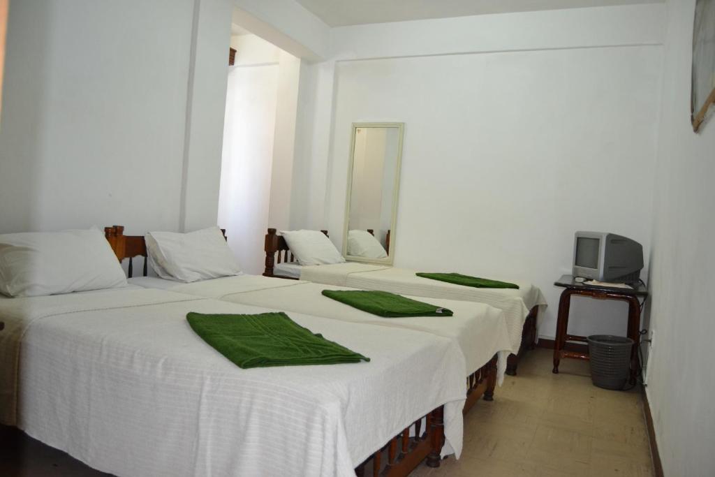 Postel nebo postele na pokoji v ubytování Manson Hotel