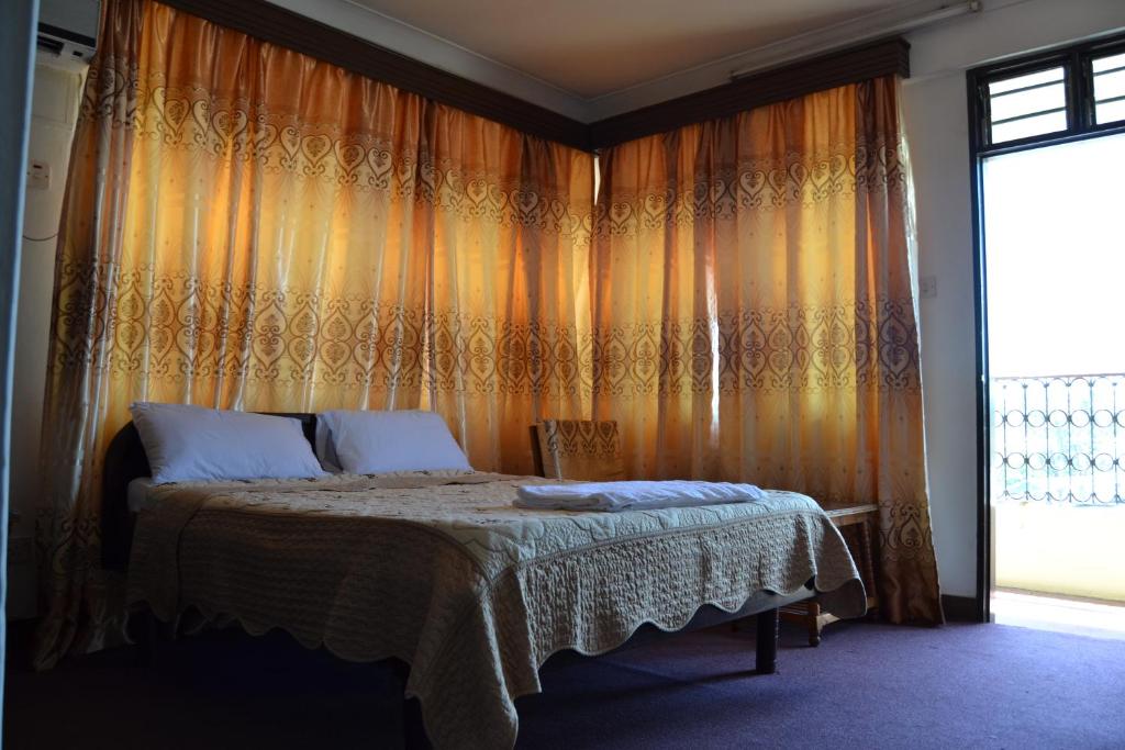 Postel nebo postele na pokoji v ubytování Manson Hotel