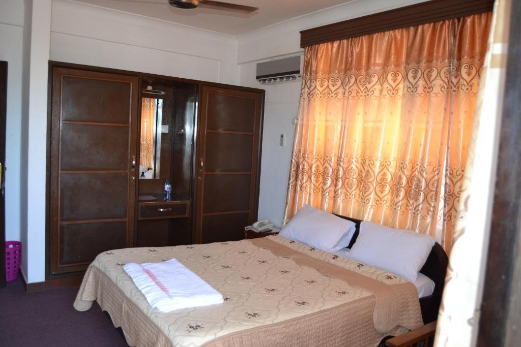 Postel nebo postele na pokoji v ubytování Manson Hotel