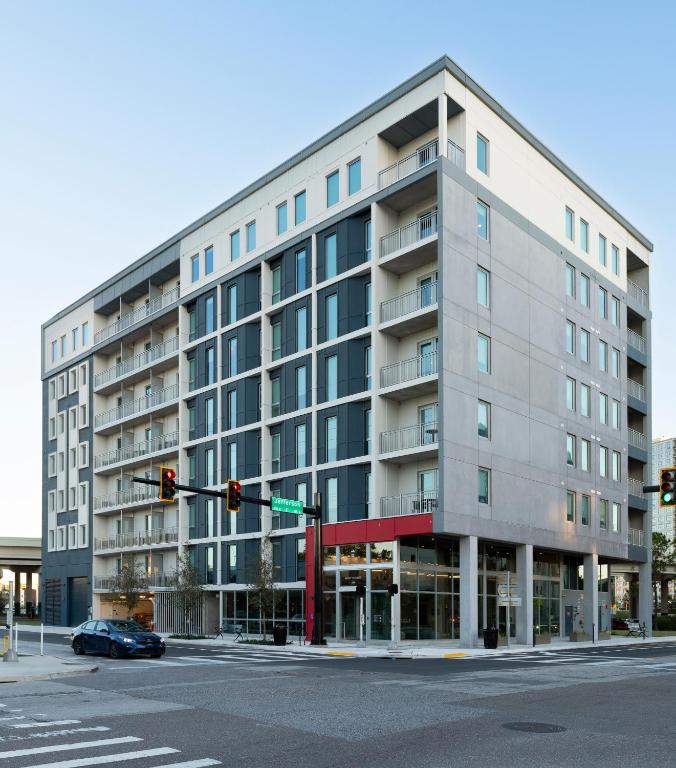 a large building on a street corner with a traffic light at Mint House Tampa Downtown by Kasa in Tampa