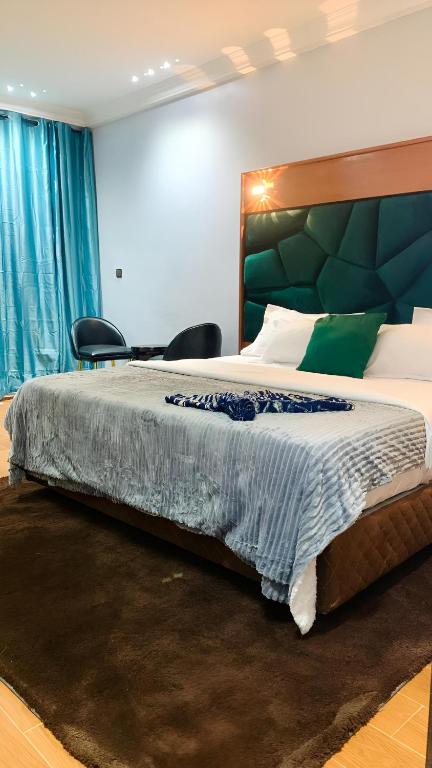 Una cama o camas en una habitación de Hôtel Foham Oasis