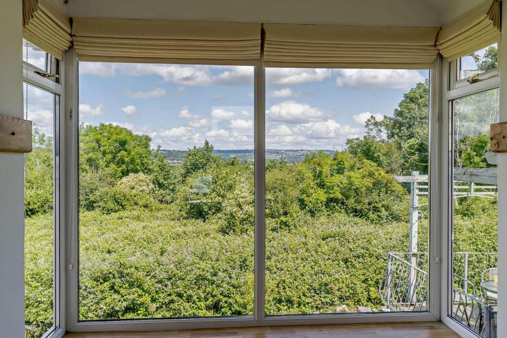 a large window in a room with a view of trees at 3 Bed in Mumbles oc-b27725 in The Mumbles