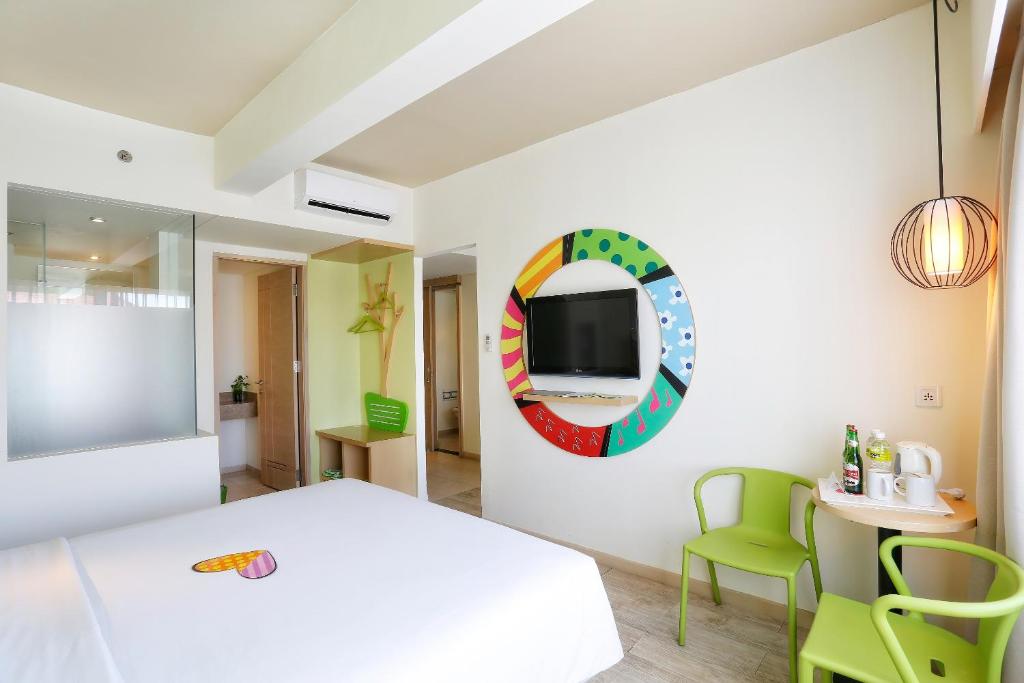 Postel nebo postele na pokoji v ubytování MaxOneHotels at Bukit Jimbaran