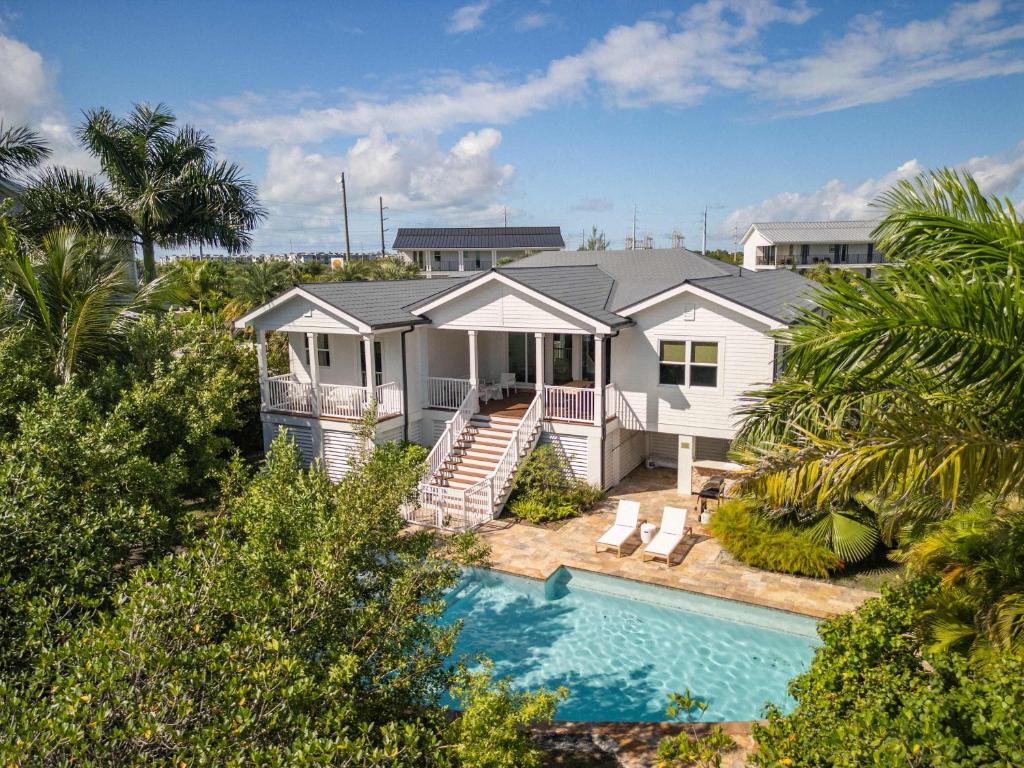 an aerial view of a house with a swimming pool at Capmar House -Huge Home & Pool in Stock Island