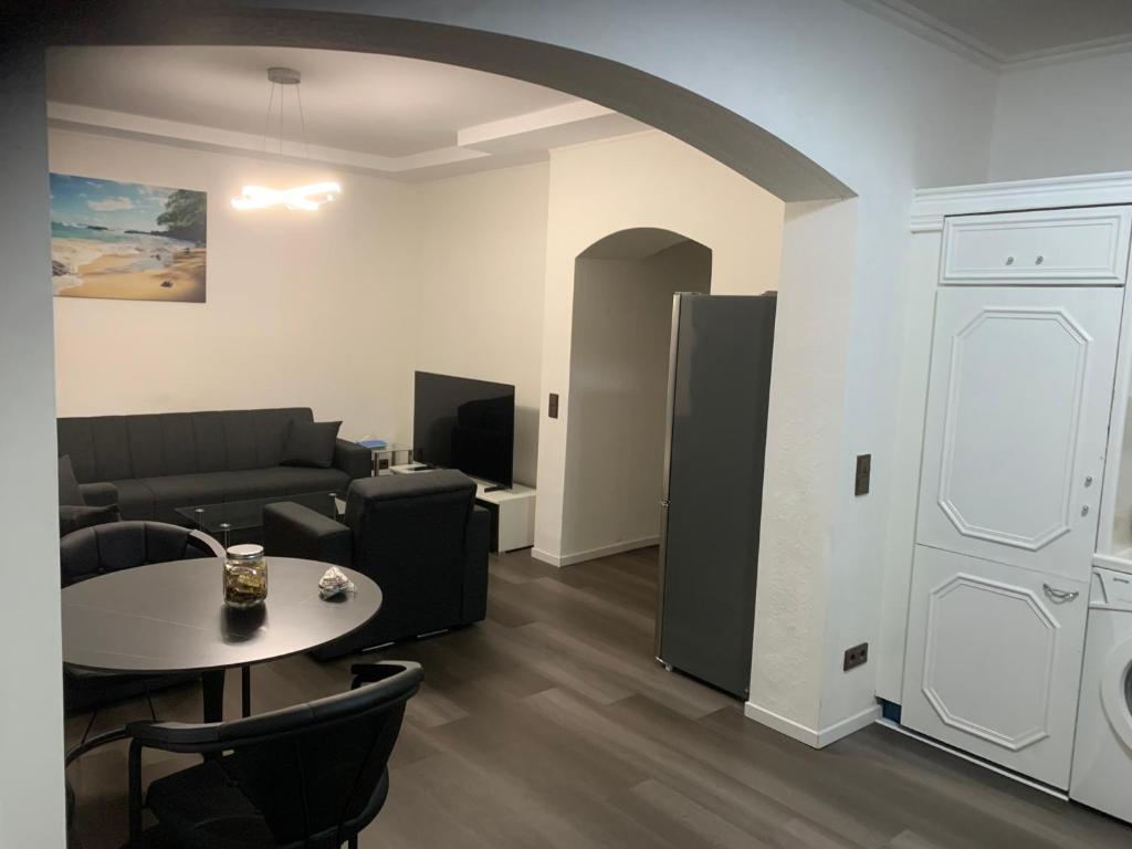 a living room with a couch and a table at KM APPARTS 5 Wesel in Wesel