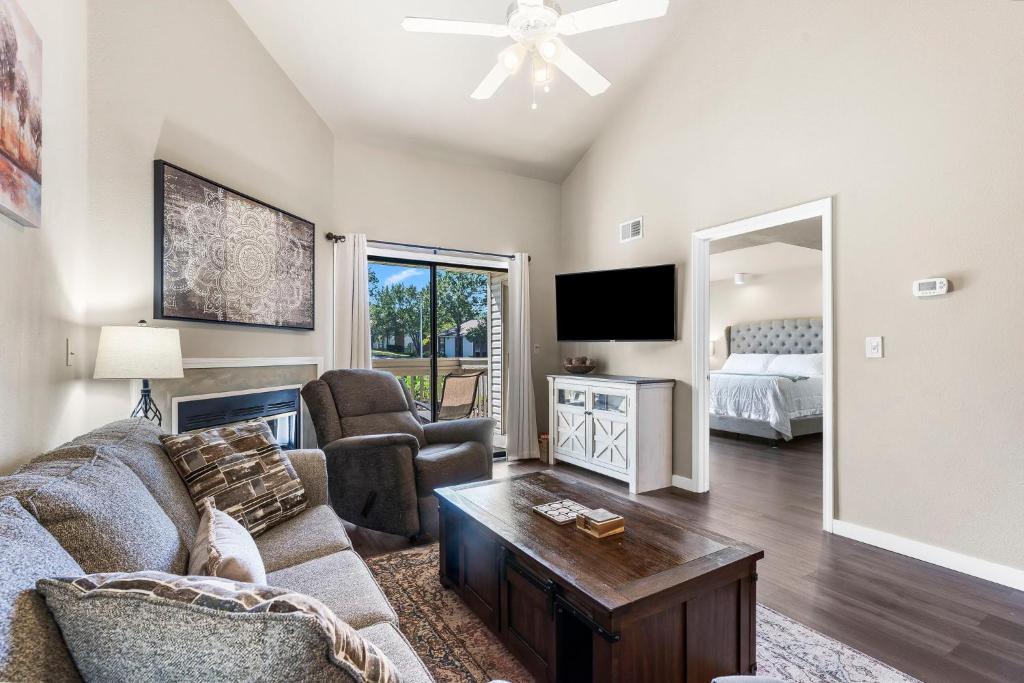 a living room with a couch and a tv at Retreat near Table Rock Lake & SDC with Indoor Pool in Branson