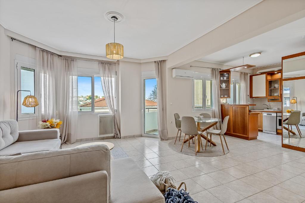 a living room with a couch and a table at Fabulous central apartment close to the sea! in Chalkida