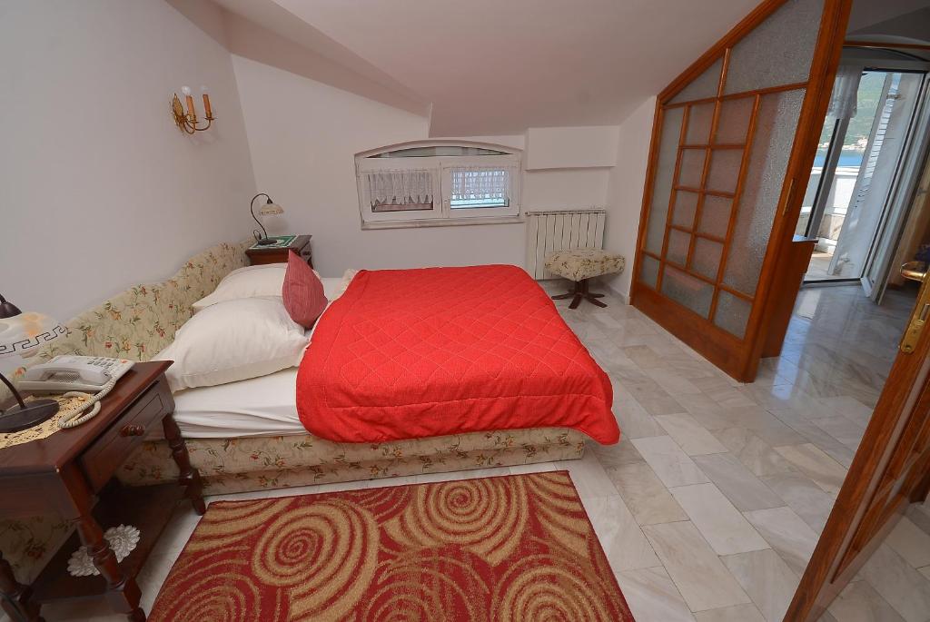 Postel nebo postele na pokoji v ubytování Hotel Vila Margot