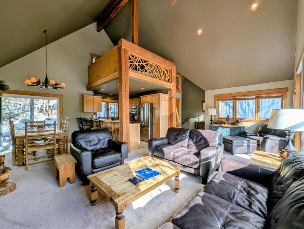 a living room with a couch and a table at Cabin in the Pines 4 by SummitCove Lodging in Colorado in Keystone