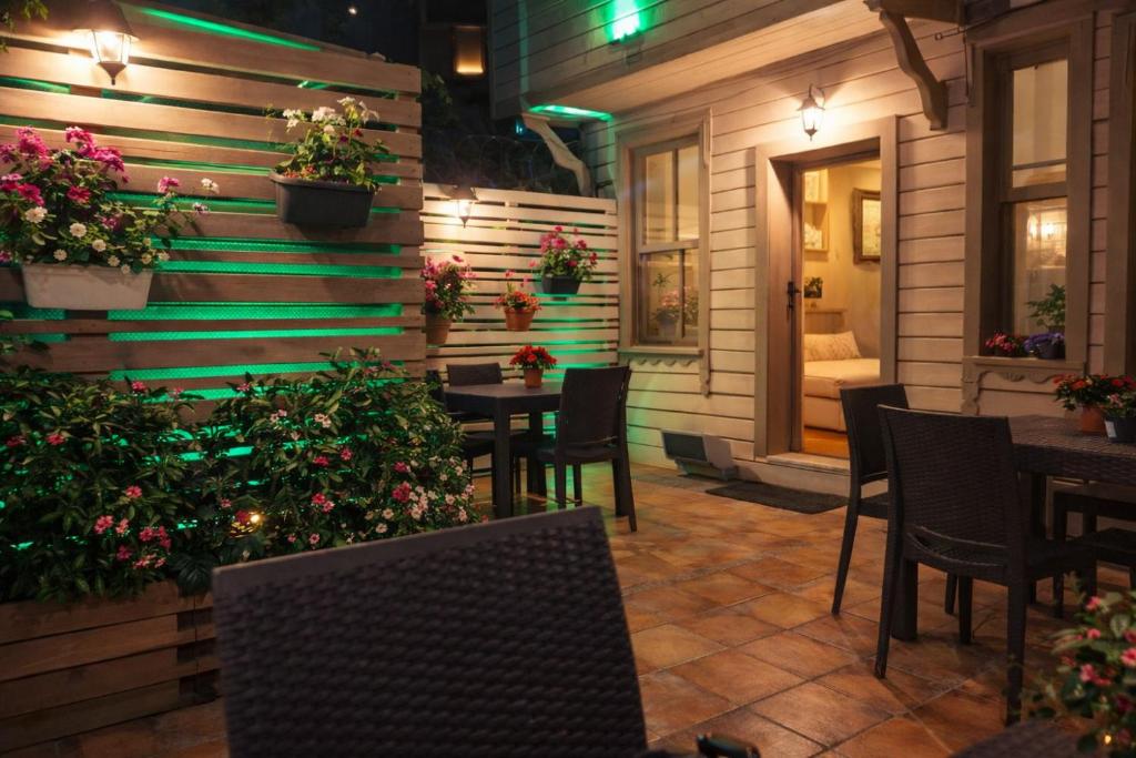 a patio with tables and chairs in a restaurant at Valide i Suit in Istanbul