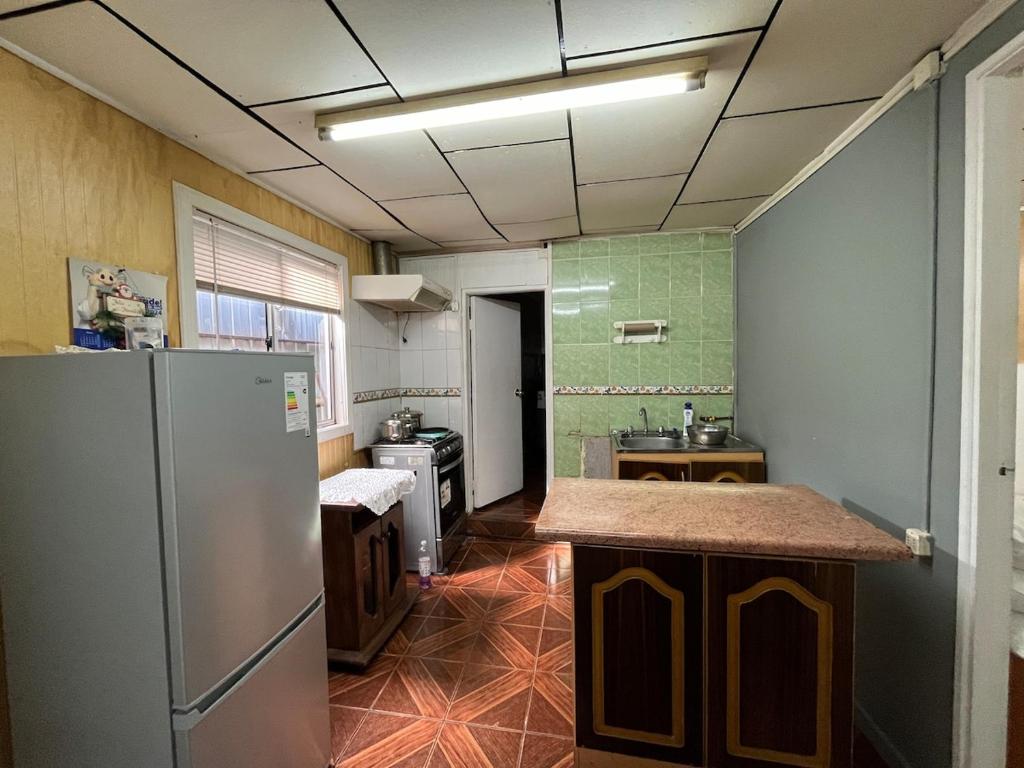 a kitchen with a refrigerator and a sink at apartamento en centro de Castro in Castro