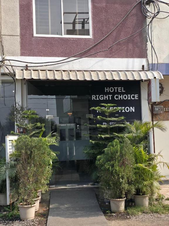 a hotel right choice sign in front of a building at Hotel Right Choice in Indore