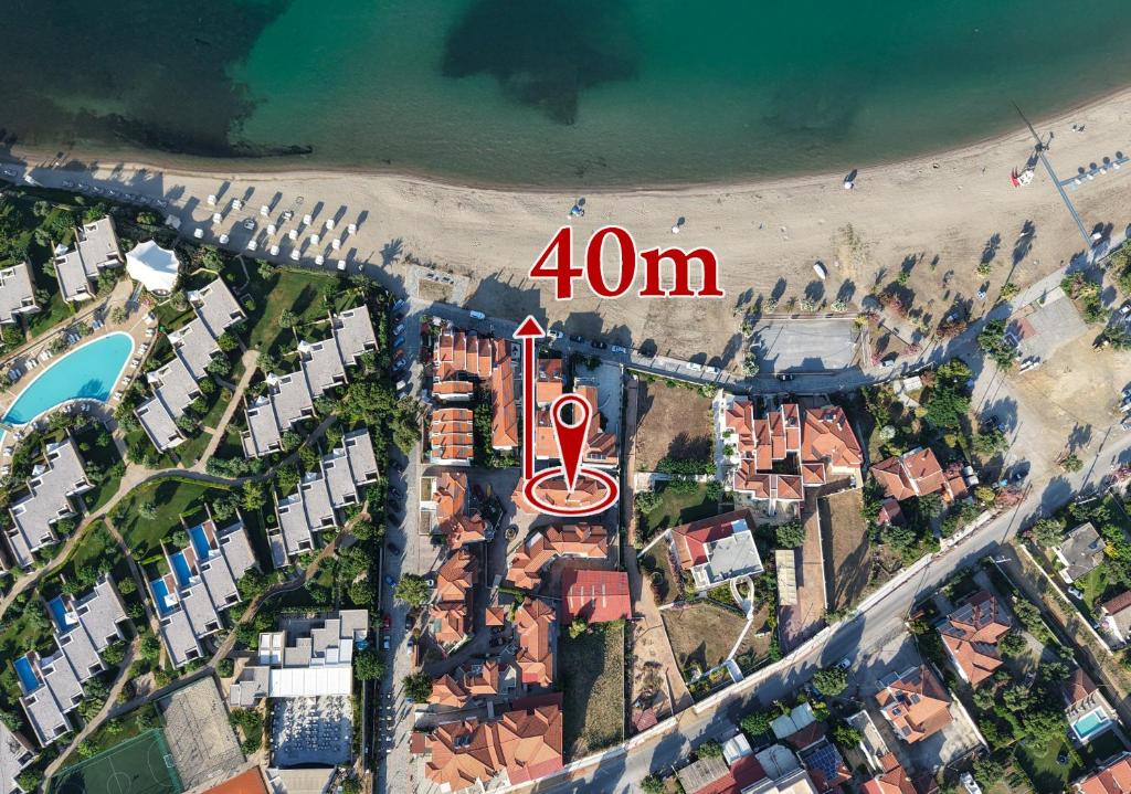 an aerial view of a beach with a sign at Golden Beach, Gerakini in Gerakini