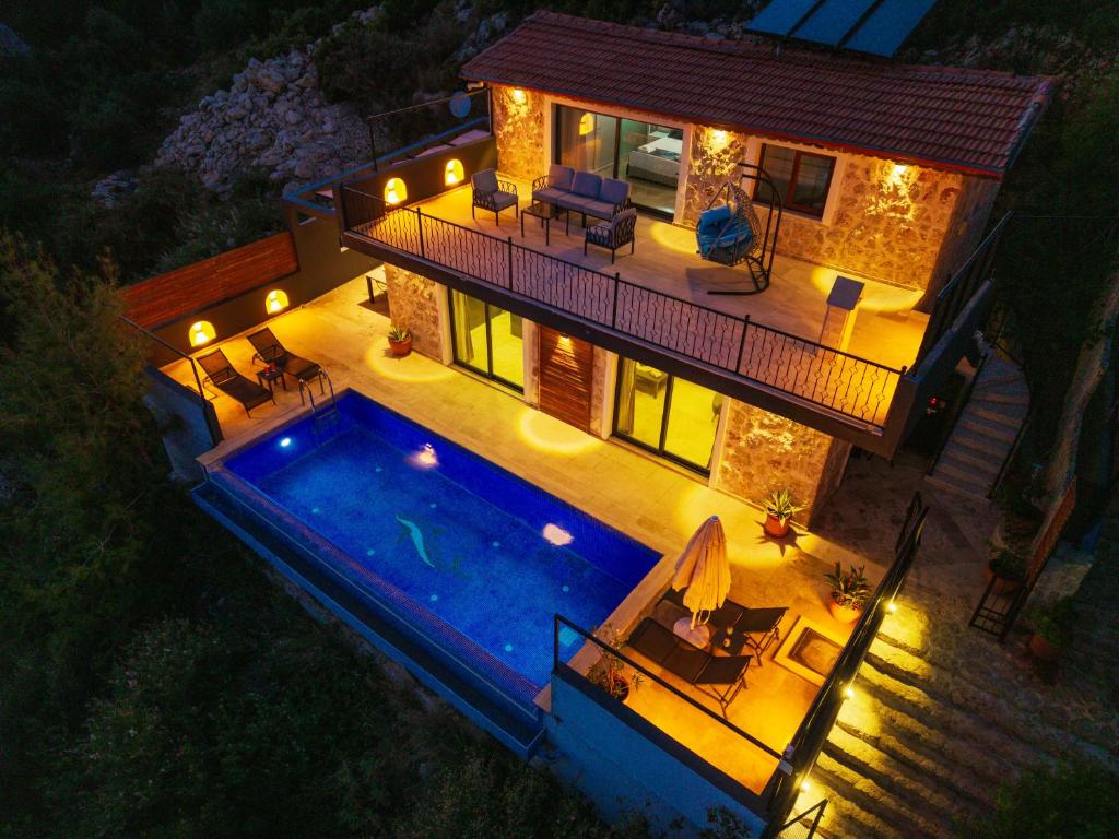 an aerial view of a house with a swimming pool at Villa Elvin in Kalkan