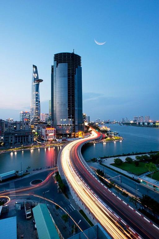 a city with traffic on a highway at night at Boutique KAS Luxury Hotel in Ho Chi Minh City