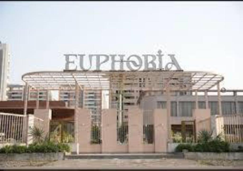 a building with a sign on top of it at Euphoria The Fine Dine in Surat