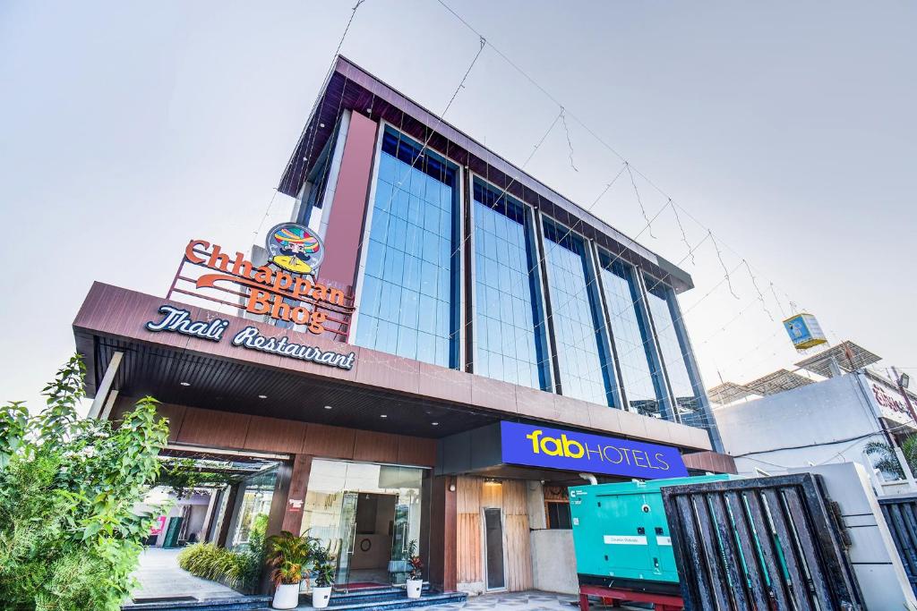 a building with a colo industries sign on it at FabHotel Chhappan in Aurangabad