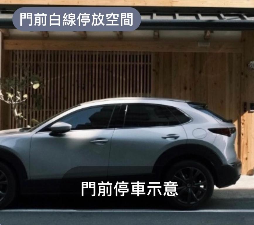 a silver car parked in front of a building at 弎秋 A chu in Chiayi City