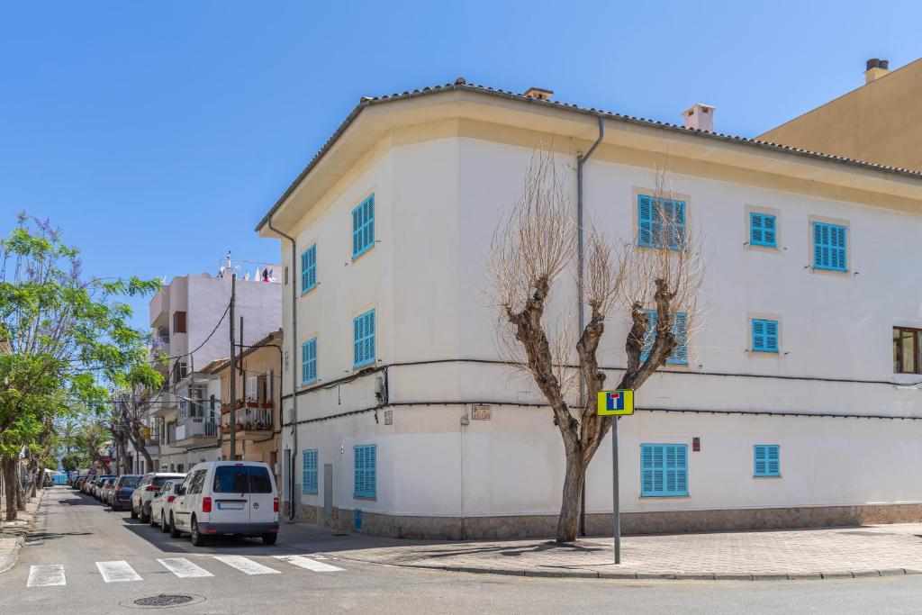 a white building on the side of a street at Albercutx Pollentia 1 2 3 in Port de Pollensa