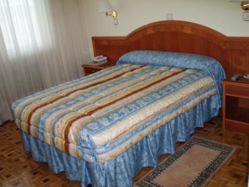 Postel nebo postele na pokoji v ubytování Hotel Buenos Aires