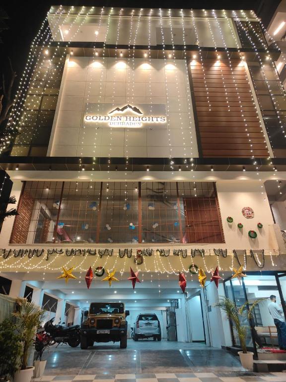 a store front with a truck parked in it at Golden Heights in Dehradun