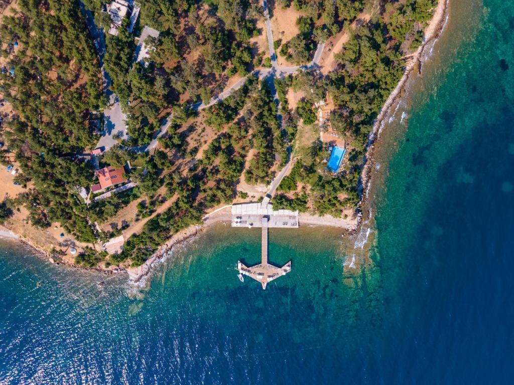 an aerial view of a small island in the ocean at Marisstone Hotels in Mecidiye