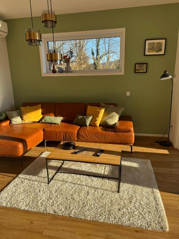 a living room with a couch and a coffee table at Haus Sonnenhang in Hauenstein