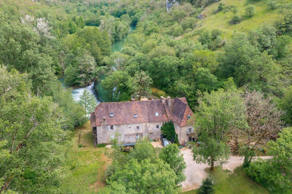 an aerial view of an old house in a forest at Moulin de Latreille in Calès
