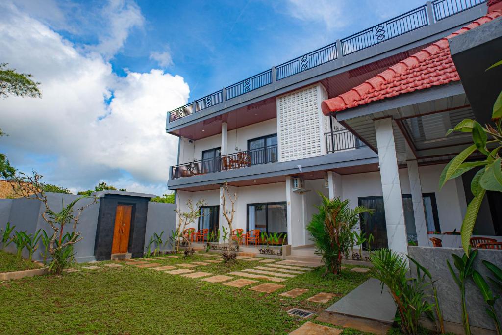 a view of a house with a yard at Sundara Haven in Ungasan